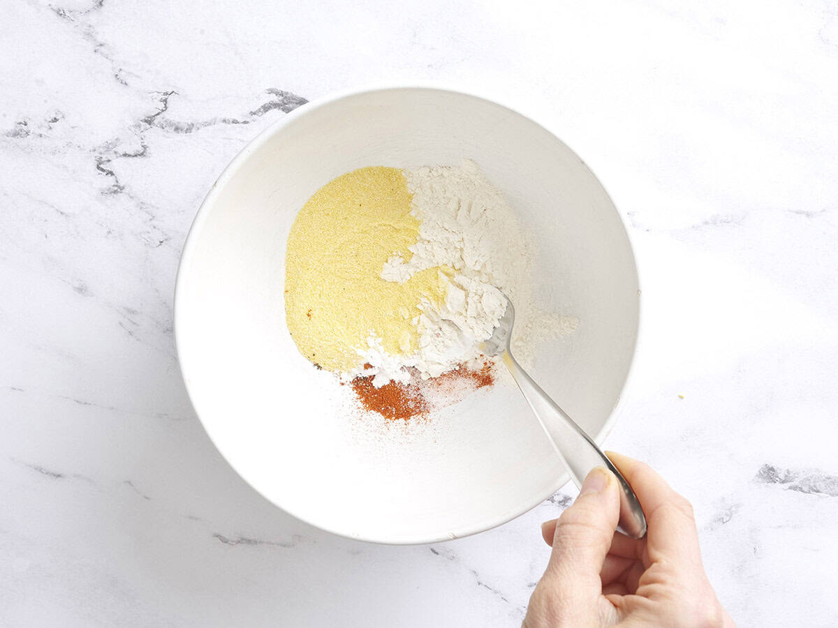 Baking powder, flour, cornmeal, salt, cayenne and cornstarch in a mixing bowl.