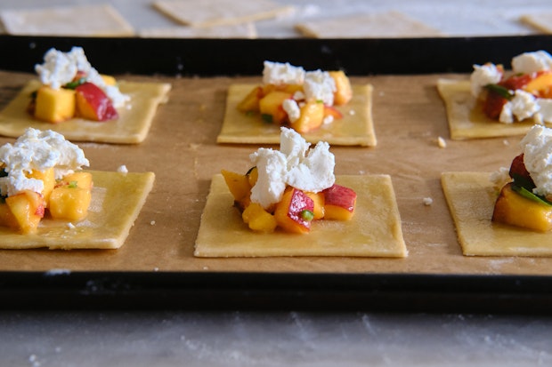 pie dough topped with peaches and goat cheese