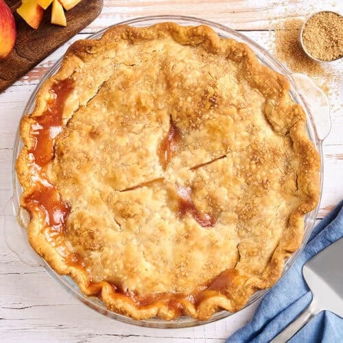 Overhead view of a homemade peach pie.