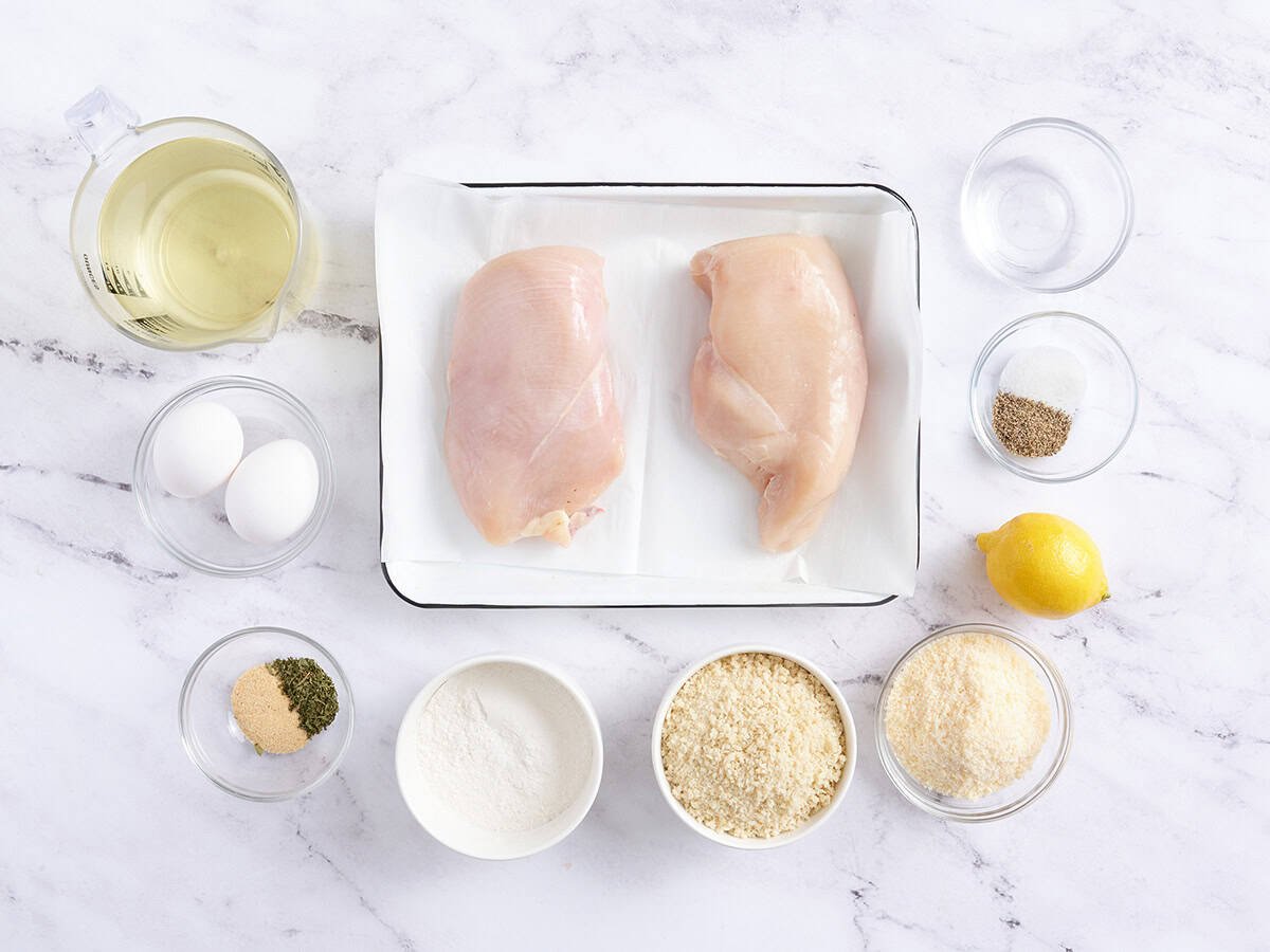 The ingredients to make chicken schnitzel.
