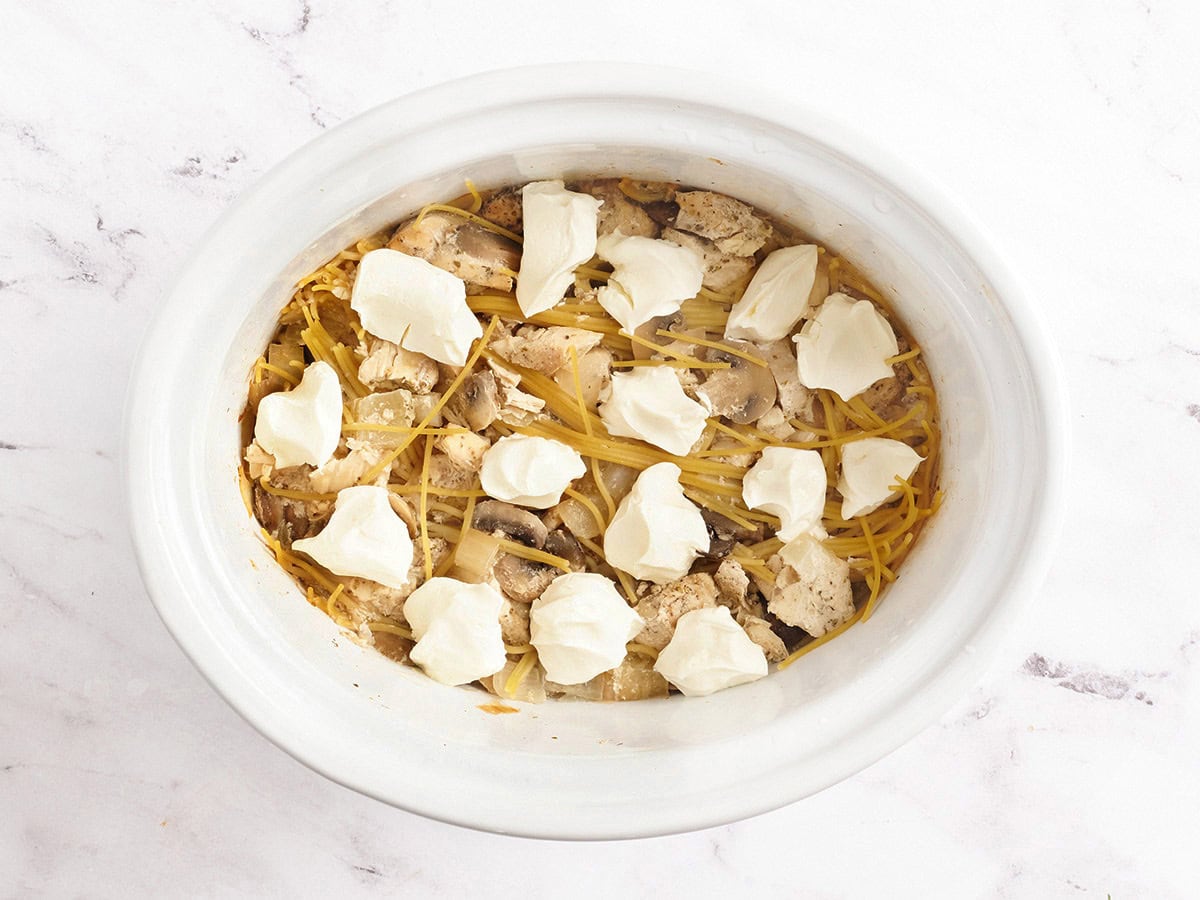 A crockpot chicken tetrazzini after the noodles have cooked.