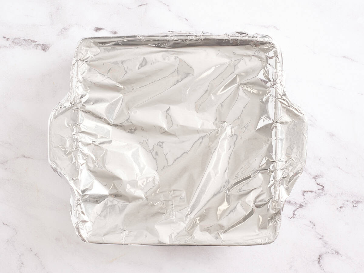 A baking dish covered in foil.