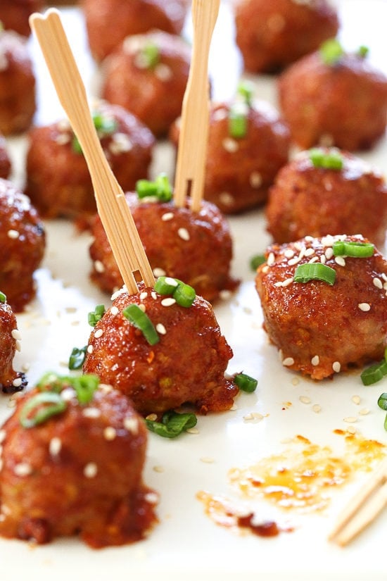 These Asian inspired turkey meatballs are seasoned with ginger and spices and finished with a sweet and spicy, gochujang glaze. Great as an appetizer or serve them with brown rice to make them a meal.
