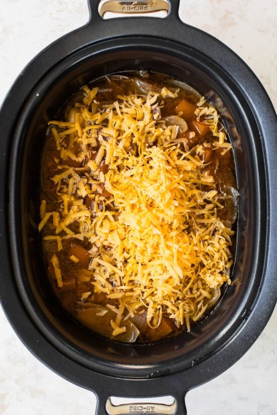 Butternut Squash Cheddar Beer Soup in the slow cooker with cheddar