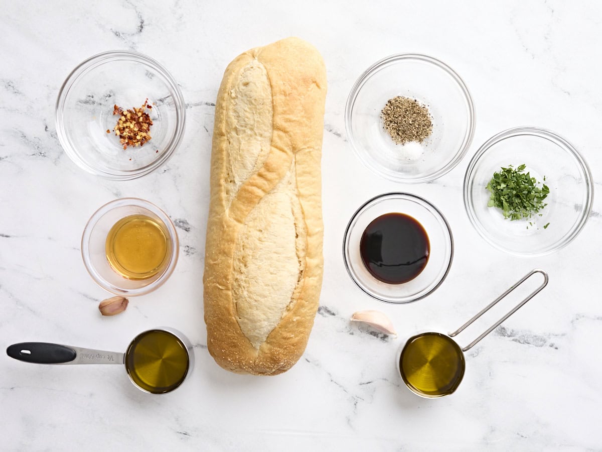 Ingredients to make two olive oil bread dips. 
