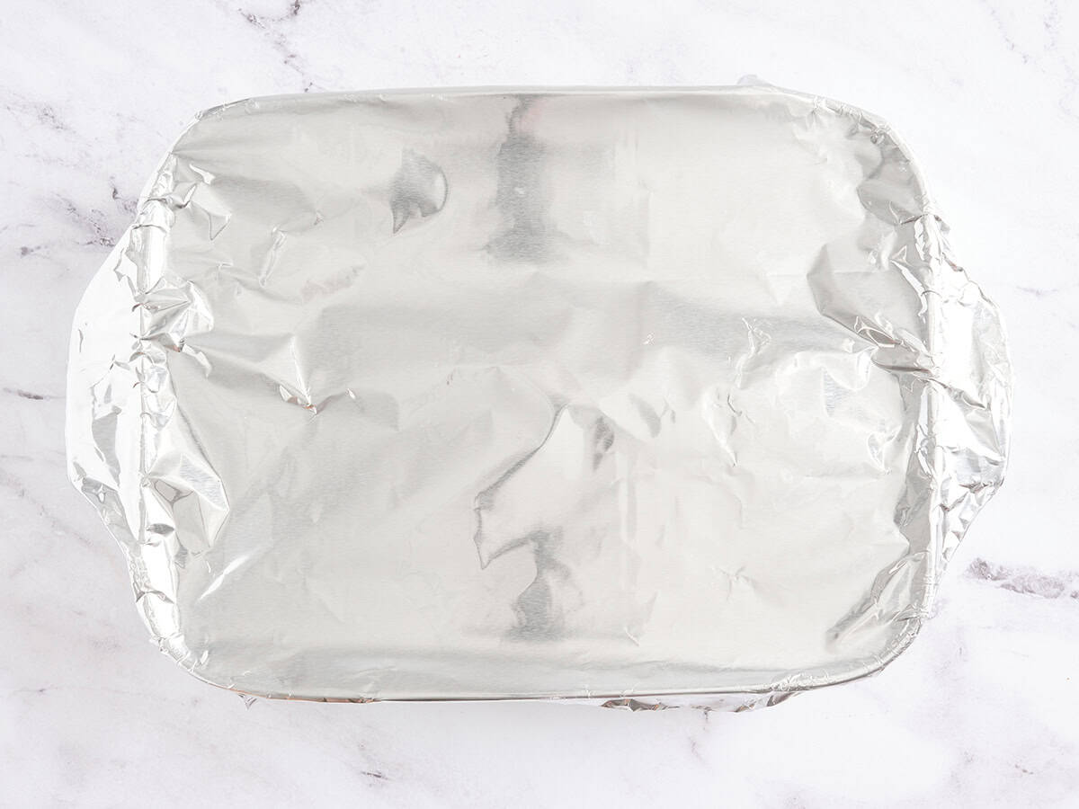 A baking dish covered with foil.
