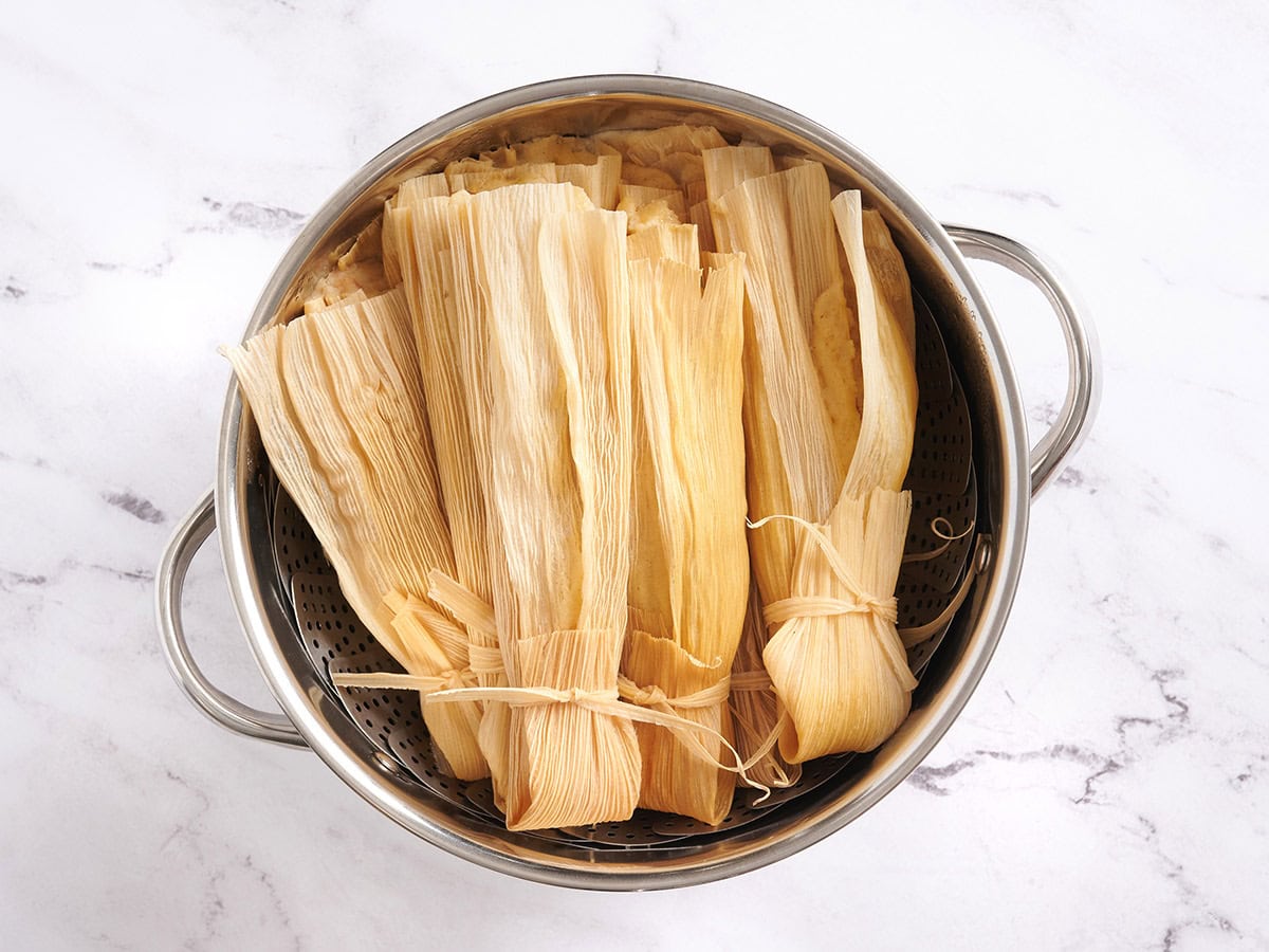 Finished tamales in a saucepan.