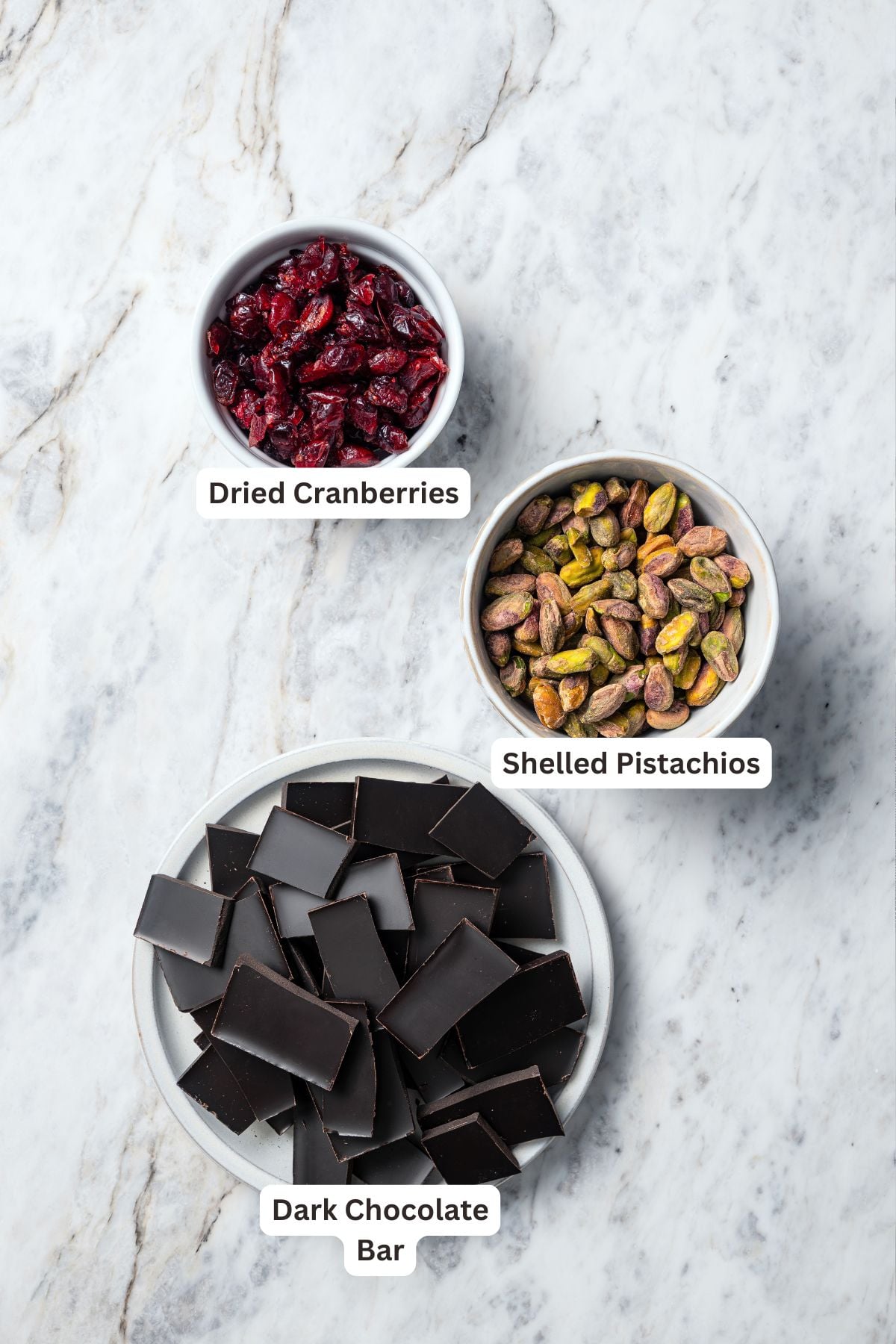 Ingredients for dark chocolate bark with pistachios and cranberries.