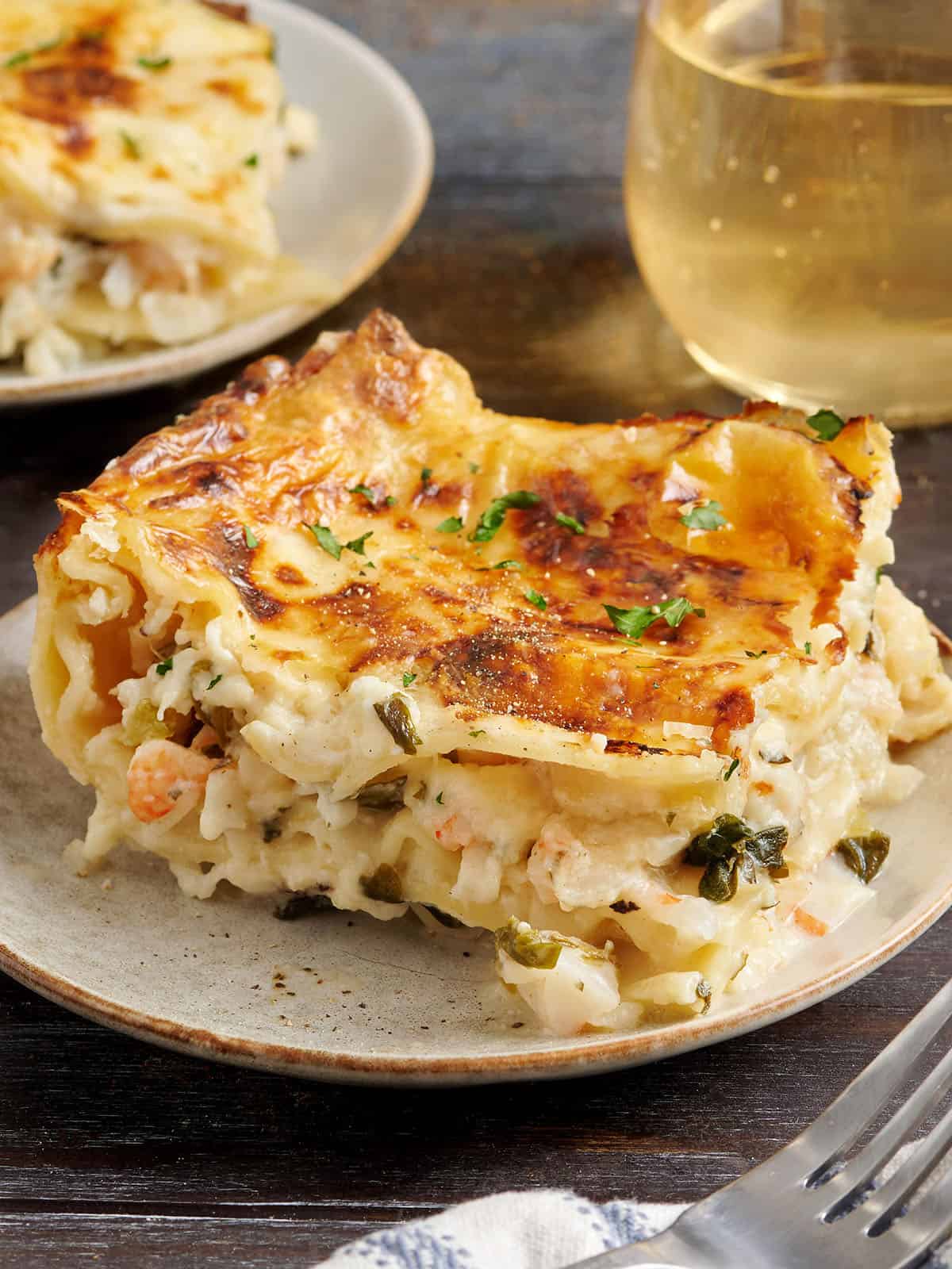Side view of a slice of seafood lasagna.