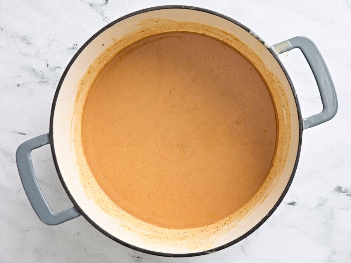 A medium brown roux in a pot.